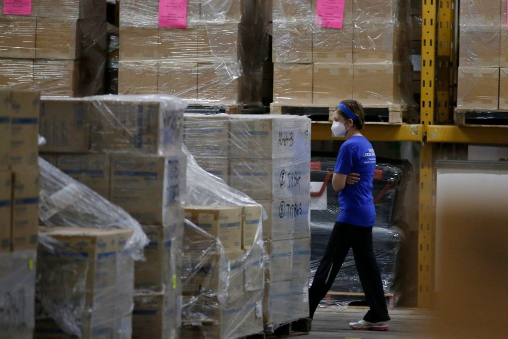 A worker walks through Oklahoma's Strategic National Stockpile warehouse