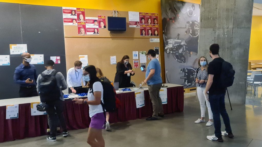 a photo of students at the event registration table