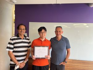 From left to right, IDSS professor David Simchi-Levi, SES student and TA Award recipient Yunzong Xu, and IDSS director Munther Dahleh.