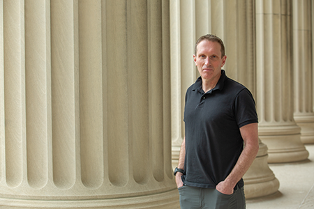 Martin Wainwright in front of the columns of MIT Building 10