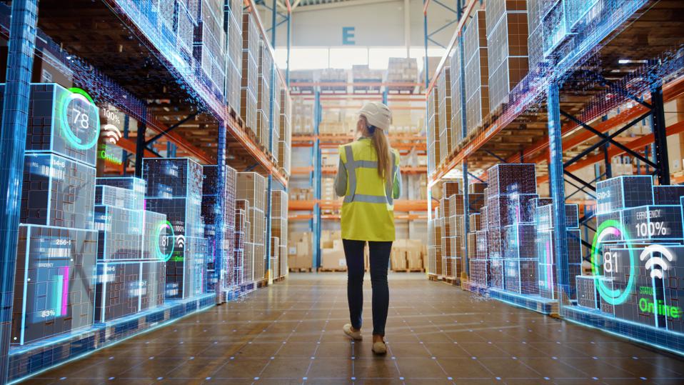 a warehouse worker looking at shelves overlaid with digital metrics