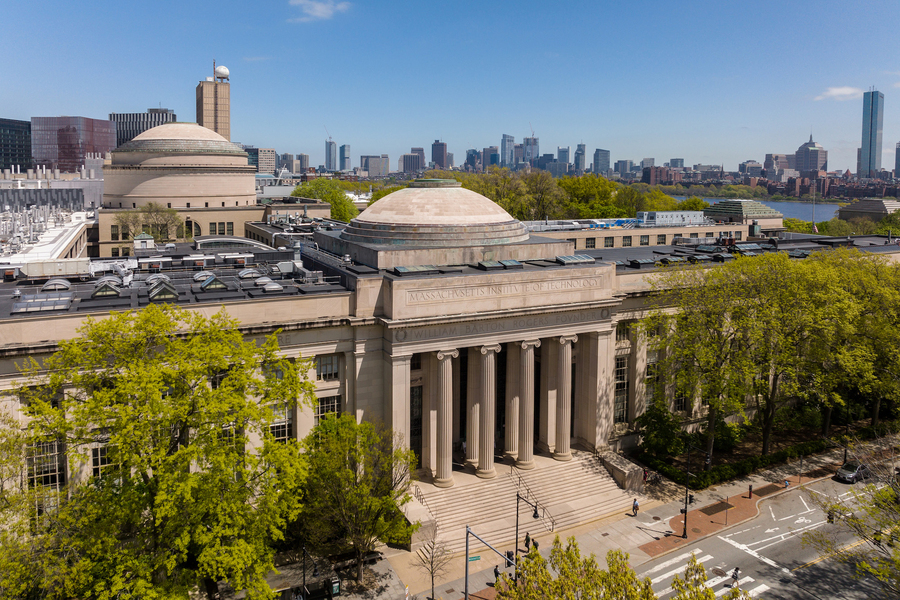 A photo of the MIT dome with Boston in the background