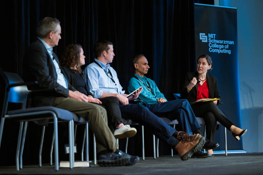 Left to right: MIT faculty members Simon Johnson, Sarah Williams, Srini Devadas, and Asu Ozdaglar on stage at the SERC symposium