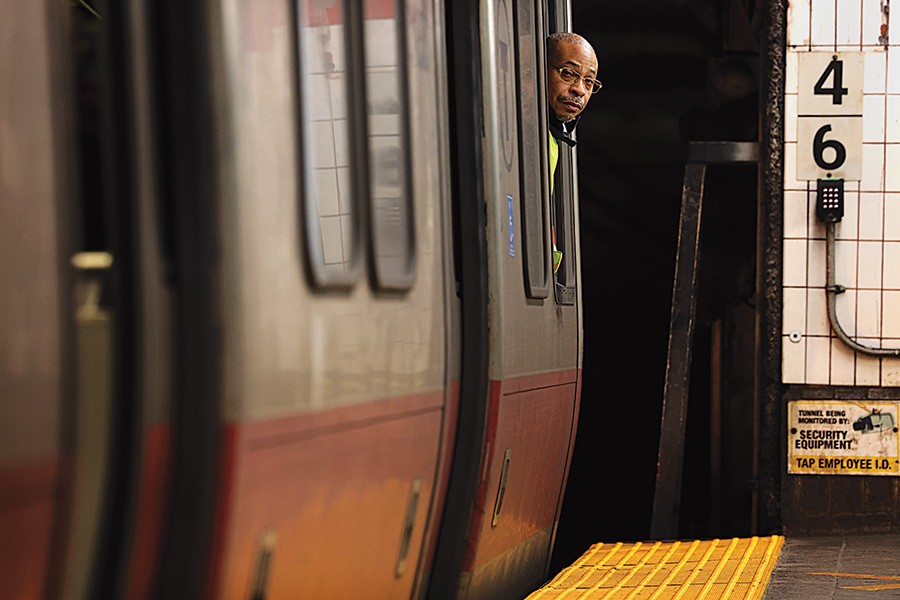Red line driver looking out of a train window. Photo by Craig F. Walker/Boston Globe via Getty Images