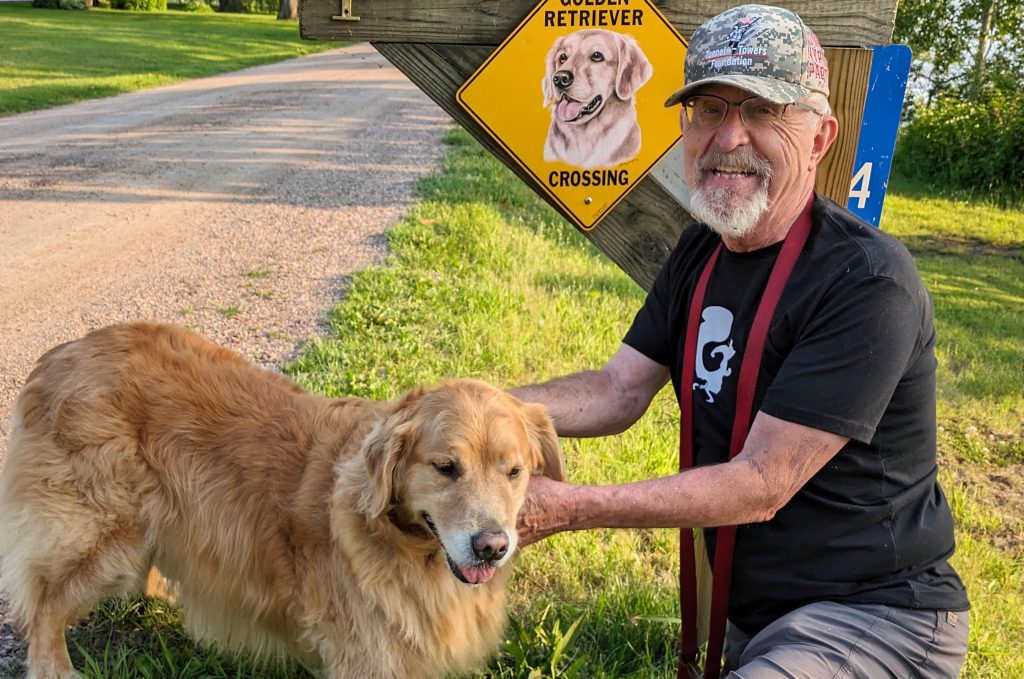 Richard Larson and his golden retriever