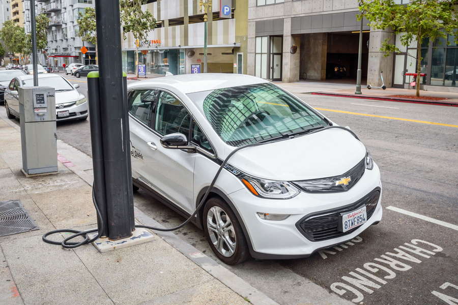 an electric car plugged into a charging station