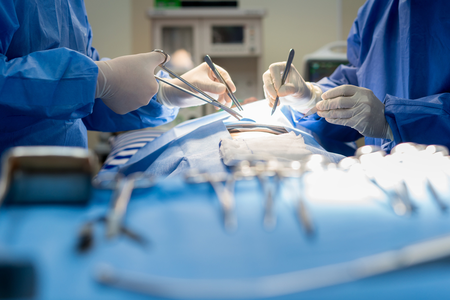 two surgeons working on a patient