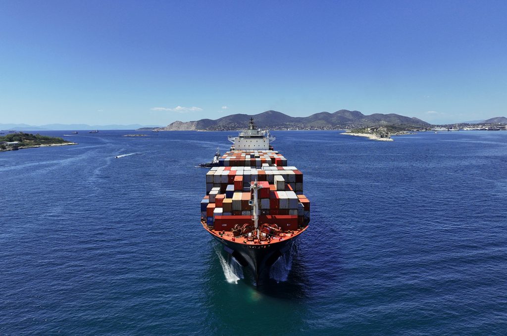 cargo ship with containers in the sea