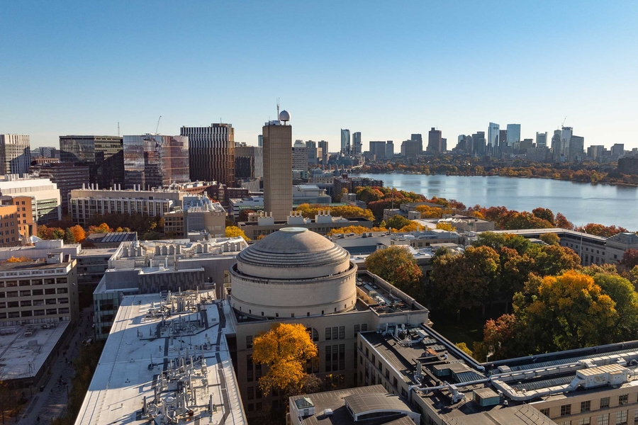 An overhead view of the MIT campus, including the MIT dome and the Charles River