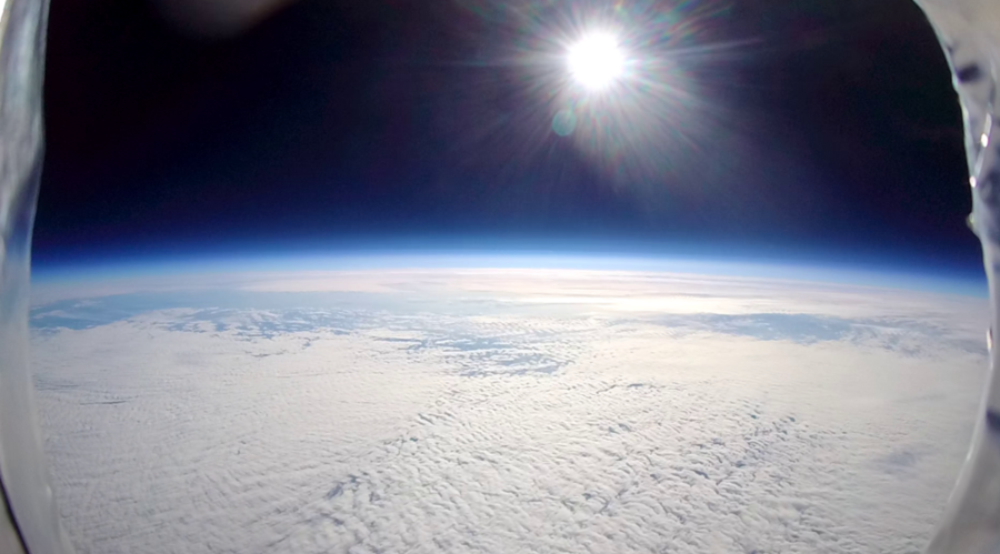 A photo of the sun shining down on the earth from 22 kilometers above